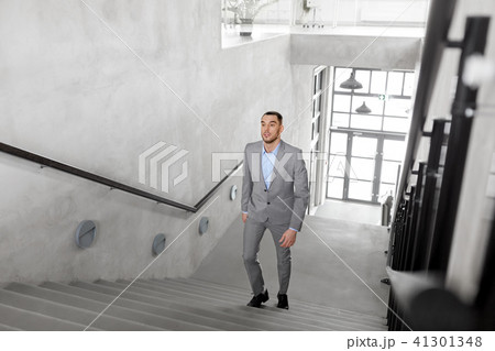 businessman walking upstairs businessman walking upstairs 41301348