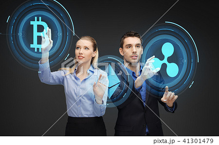 businesspeople with cryptocurrency holograms businesspeople with cryptocurrency holograms 41301479