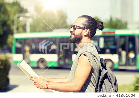 man traveling with backpack and map in city 41301604