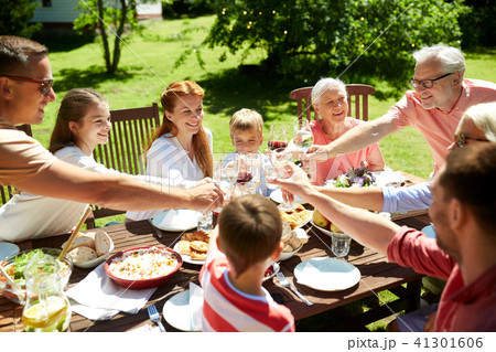 happy family having dinner or summer garden party 41301606