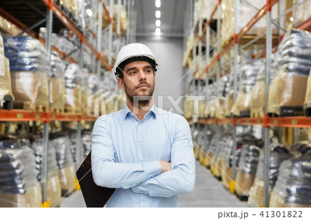 businessman in helmet at warehouse 41301822