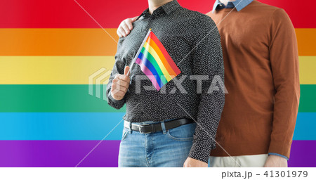 close up of male couple with gay pride flag 41301979