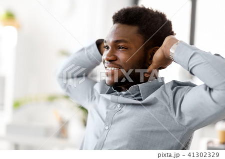 smiling african american businessman at office 41302329
