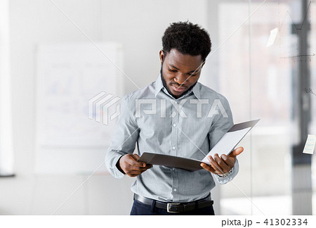 african american businessman with folder at office 41302334