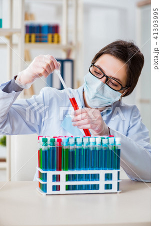 Female chemist working in hospital lab 41303995