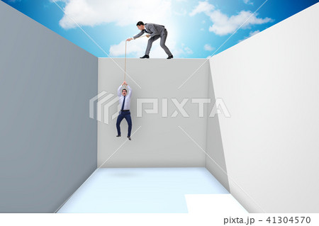 Businessman helping colleague to escape from problems 41304570