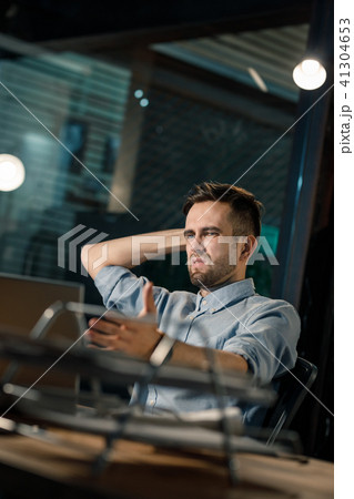 Confused man with broken computer 41304653