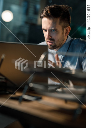 Employee irritated with laptop work Employee irritated with laptop work 41304655