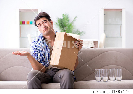 Man receiving wrong parcel with glasses Man receiving wrong parcel with glasses 41305172