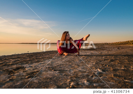 yoga woman on the beach at sunset. 41306734