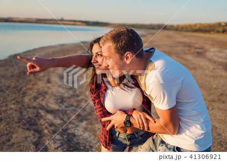 lovestory of couple on the beach On the Sunset 41306921