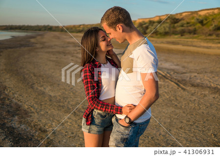 lovestory of couple on the beach On the Sunset 41306931