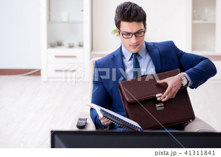 Businessman watching tv in the office 41311841