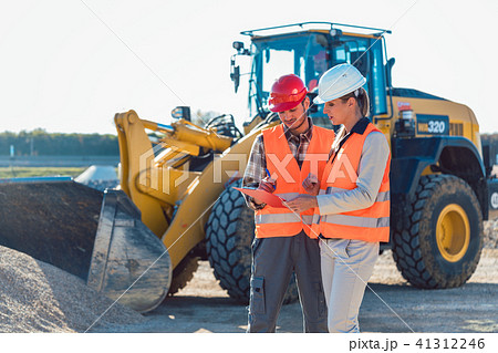 Man and woman worker on construction site 41312246