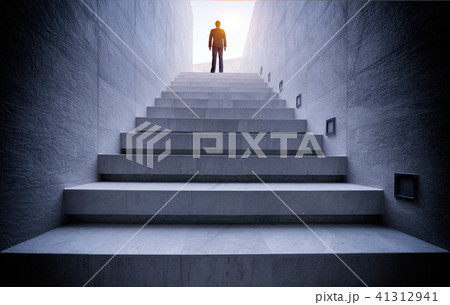Businessman standing on stair 41312941