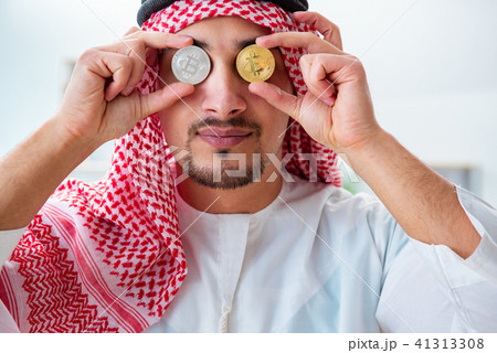 Arab man with bitcoin in cryptocurrency mining concept 41313308