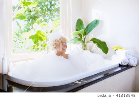 Child in bubble bath. Kid bathing. Baby in shower. 41313948