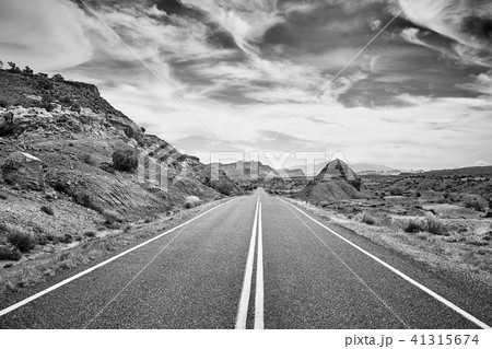 Black and white picture of a deserted road, USA. Black and white picture of a deserted road, USA. 41315674