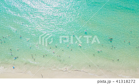 People bathing in the sun, swimming on the beach 41318272