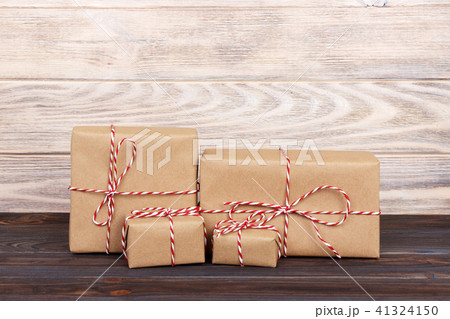 Image of handmade gift boxes on wooden table Image of handmade gift boxes on wooden table 41324150