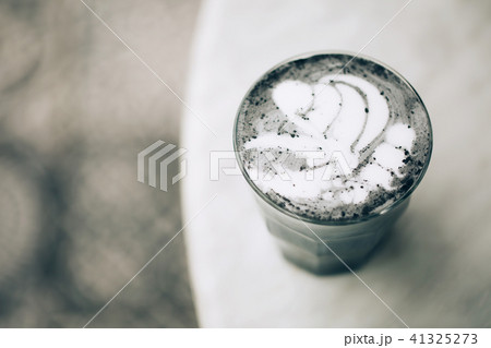 Beautiful activated charcoal latte 41325273
