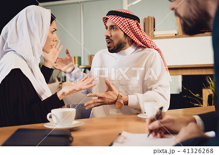Arab couple at therapist reception quarrel. 41326268