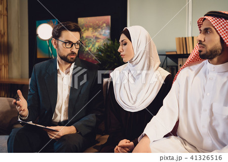 Family therapist in office helps Arab couple. Family therapist in office helps Arab couple. 41326516
