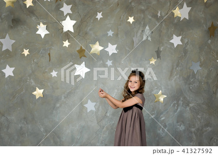 portrait of a happy girl on a background of stars portrait of a happy girl on a background of stars 41327592