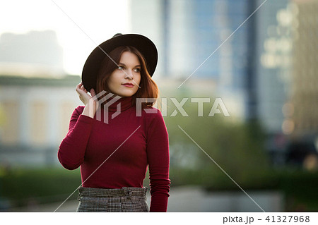 A young teenage girl in a black shirt and hat A young teenage girl in a black shirt and hat 41327968