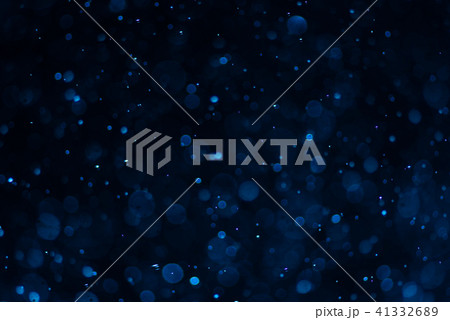 Abstract blue bokeh with black background Abstract blue bokeh with black background 41332689