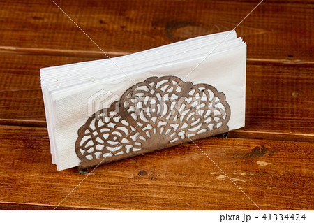 Paper napkin over wooden 41334424
