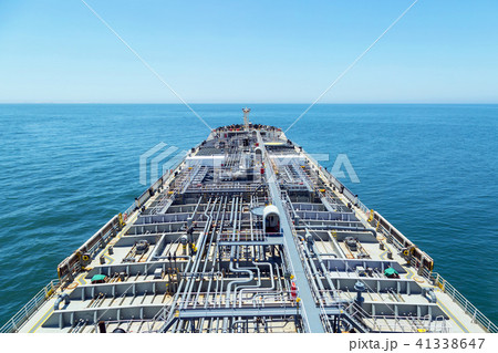 Oil product tanker steaming through blue sea. Oil product tanker steaming through blue sea. 41338647