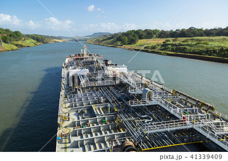 Oil product tanker is proceeding throught the Panama Canal at day time. 41339409