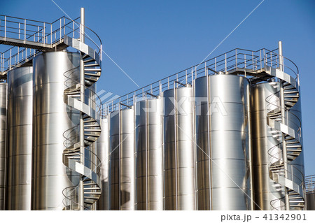 Silver wine Silos with blue sky in background Silver wine Silos with blue sky in background 41342901