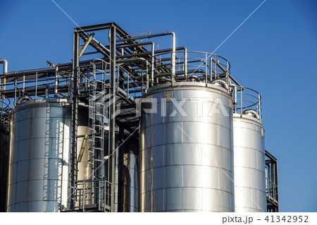 Silver wine Silos with blue sky in background Silver wine Silos with blue sky in background 41342952