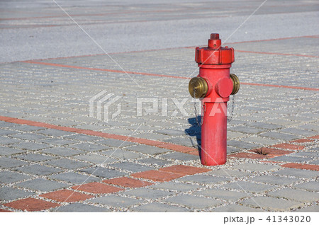 Old red fire hydrant in the street. Fire hidrant for emergency fire access 41343020