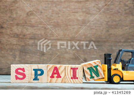 Yellow forklift hold letter block N to word Spain Yellow forklift hold letter block N to word Spain 41345269