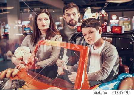 Family, son sitting on toy car 41345292