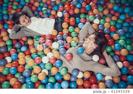 Top view. Happy mom and son in pool with balls 41345339