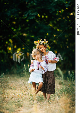 The girl in the embroidered and wreathed smiles. 41345482