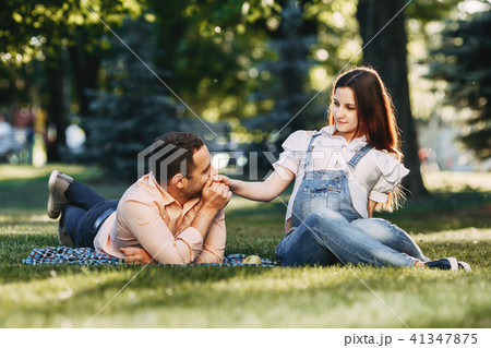 Happy pregnant couple enjoy time together Happy pregnant couple enjoy time together 41347875