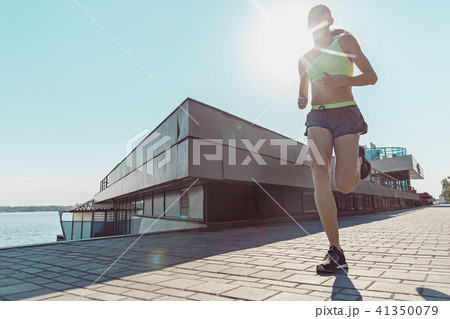 Pretty sporty woman jogging at city Pretty sporty woman jogging at city 41350079