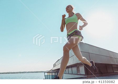 Pretty sporty woman jogging at city Pretty sporty woman jogging at city 41350082