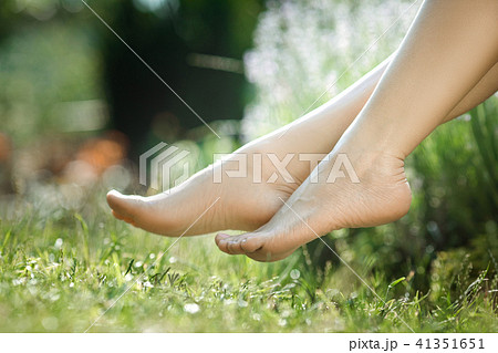 female legs walking on green grass 41351651