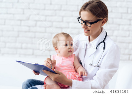 Professional pediatrician doctor exam newborn. 41352192