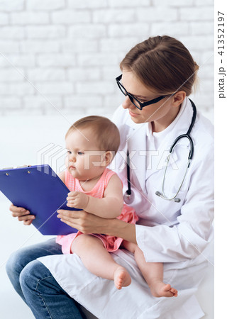 Professional pediatrician doctor exam newborn. 41352197