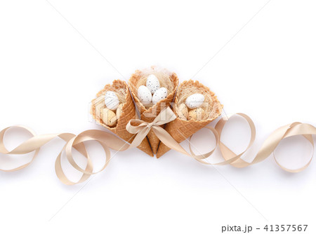 easter waffle cones with small eggs on white 41357567