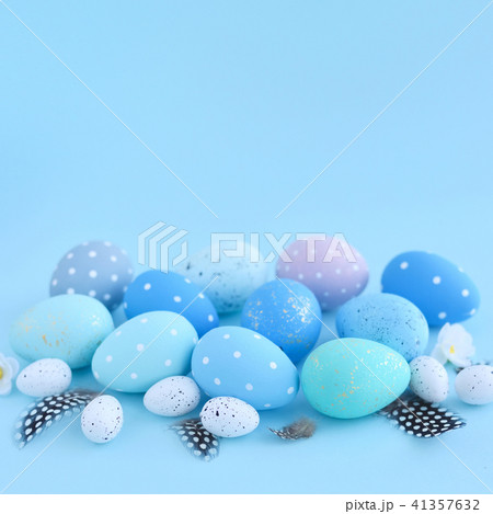 Easter eggs on blue background with empty space 41357632