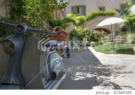 Scooter parked on a terrace Scooter parked on a terrace 41360169