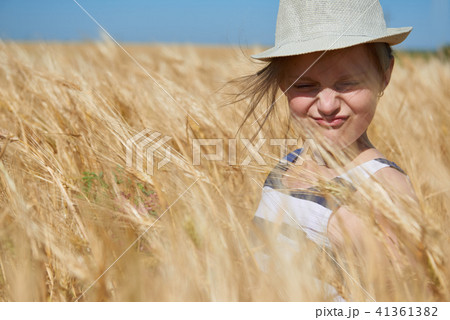 child girl walking in the yellow wheat field child girl walking in the yellow wheat field 41361382